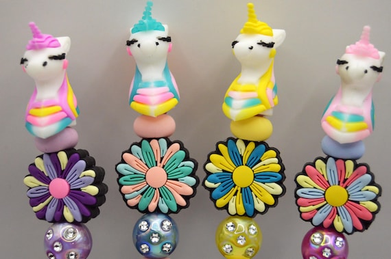 Unicorn topper pen set, includes 2 refills for each pen.