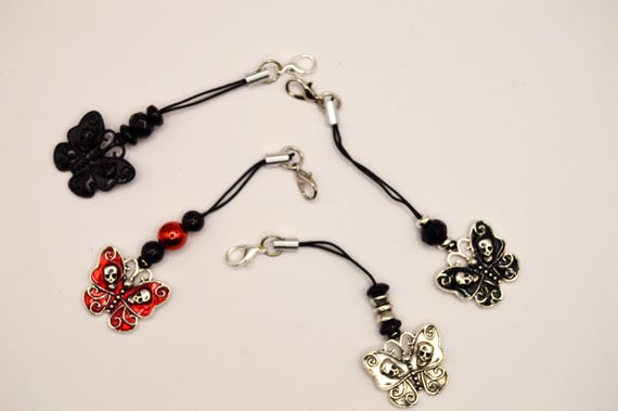 Butterfly Skulls phone charms. Choice of one, dust plug included