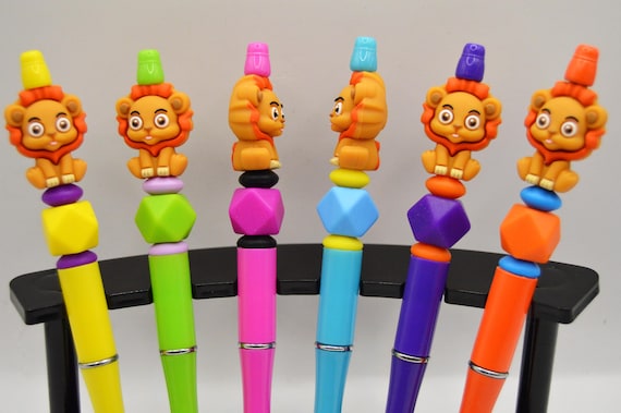 Bright and Colorful Lion Pens, includes refills.