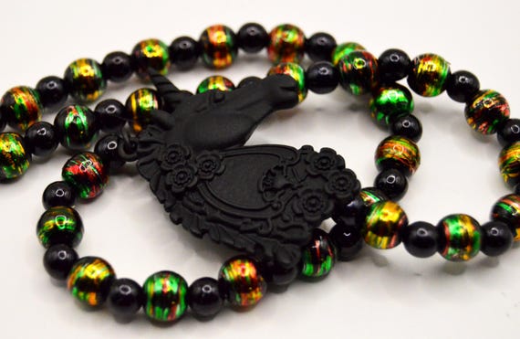 Black Unicorn Necklace: Gold Swirled Glass Beads, Elegant Dark Pendant