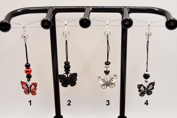 Butterfly Skulls phone charms. Choice of one, dust plug included
