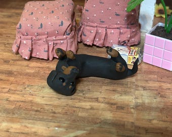 Black And tan dachshund rolling on back  polymer clay sculpture