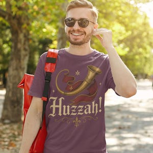 Casual festival cosplay Huzzah t-shirt, funny medieval nerd gift for renaissance fair fans.