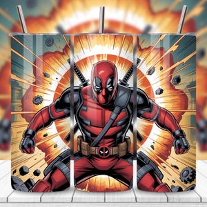 May include: A set of three stainless steel insulated tumblers featuring a comic book style illustration of Deadpool. The design shows Deadpool in his red and black suit with swords, set against an orange explosion background.