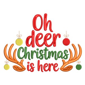 May include: A festive Christmas design with the words "Oh deer Christmas is here" in red and green script. The design includes orange deer antlers and hanging ornaments in yellow, red, and green.