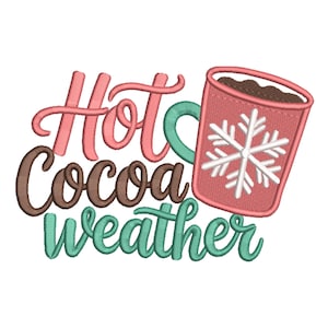 May include: An embroidered design featuring the words "Hot Cocoa Weather" in pink, brown, and teal script. A pink mug with a white snowflake design and filled with cocoa is also shown.