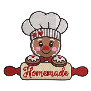 May include: A gingerbread chef with a white chef's hat, holding a rolling pin with the word "Homemade" in red script. The gingerbread man has a red nose, pink cheeks, and two heart-shaped cookies.