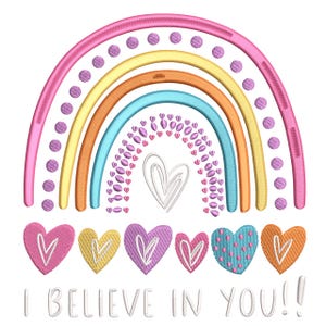 May include: A vibrant rainbow illustration featuring pink, yellow, orange, and blue arches, decorated with purple dots and heart motifs. Below the rainbow are six embroidered hearts in different colours. The text "I BELIEVE IN YOU!!" is displayed beneath the hearts.