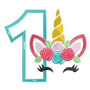 May include: A teal number one with a unicorn face design. The unicorn has a golden horn, pink and white ears, and a floral crown with pink, white, and teal roses. Black eyelashes complete the design.