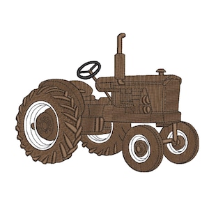 May include: A brown tractor embroidery design featuring a large rear tire with deep treads, a smaller front tire, a vertical exhaust pipe, and a steering wheel. The design is rendered in a monochromatic brown thread with white accents on the wheel rims.