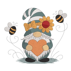 May include: A whimsical illustration of a garden gnome holding an orange heart, adorned with a sunflower and bow. Two bees fly nearby. The gnome wears a striped hat and has a long white beard. The design is embroidered.