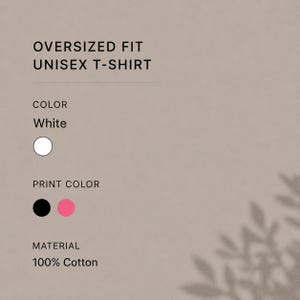 May include: White oversized fit unisex t-shirt. The colour is white, and the print colours are black and pink. The material is 100% cotton.