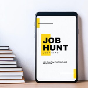 May include: A smartphone displays the text "JOB HUNT JUMP START" in black and yellow. A stack of books and a potted plant are to the left. The phone's screen also includes the text "YOUR STEP-BY-STEP PLAN TO LAND YOUR FIRST JOB WITH CONFIDENCE AND CLARITY."