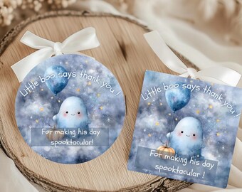 May include: Two gift tags featuring a watercolour illustration of a friendly ghost holding a blue balloon. The tags have the text "Little boo says thank you!" and "For making his day spooktacular!" tied with white ribbons.