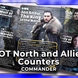 May include: A collection of Game of Thrones trading cards featuring characters like Jon Snow, Arya Stark, and Ned Stark. The cards have character portraits and game text, with the title "GOT North and Allies Counters Commander" displayed prominently.