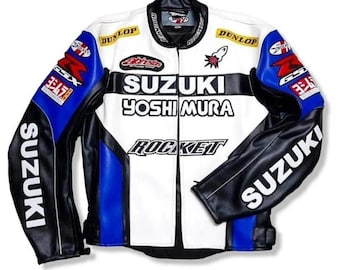 May include: A white, black, and blue motorcycle jacket with the Suzuki, Yoshimura, and Rocket logos. The jacket has black sleeves with white Suzuki text, blue shoulder accents, and Dunlop patches. The collar and zipper are black.