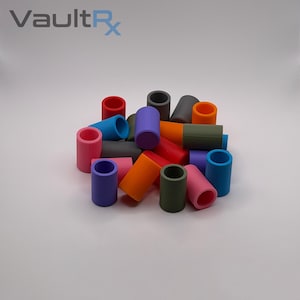 May include: A collection of colorful, cylindrical objects in various shades, including red, blue, purple, and orange. The objects are arranged in a pile, with the text "VaultRx" in the upper left corner.