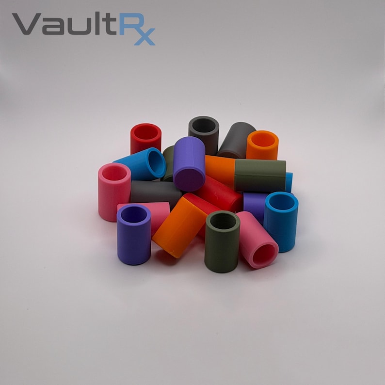 May include: A collection of colorful, cylindrical objects in various shades, including red, blue, purple, and orange. The objects are arranged in a pile, with the text "VaultRx" in the upper left corner.