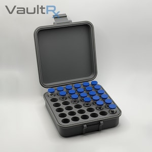 May include: A gray, open case with a hinged lid, filled with small glass vials with blue caps. The case is designed to hold the vials securely. The VaultR logo is visible in the upper left corner.
