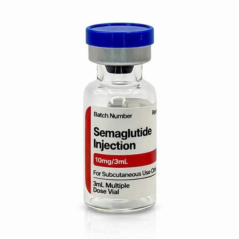 May include: A clear glass vial with a blue cap and a silver top. The vial has a red and white label with the text "Semaglutide Injection 10mg/3mL" and "For Subcutaneous Use Only". The vial contains 3mL of liquid.