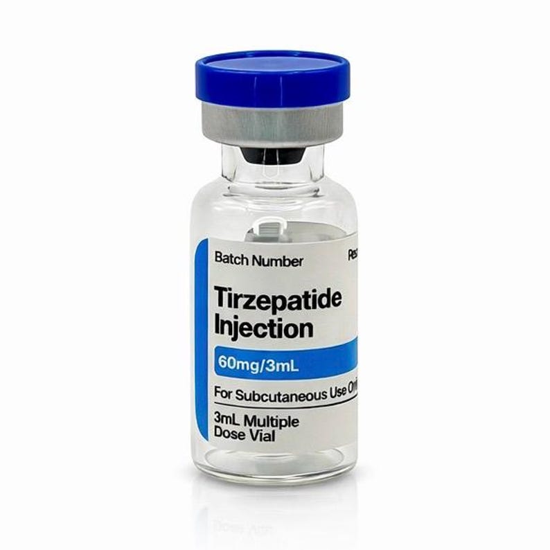 May include: A clear glass vial with a blue cap and a silver metal seal. The vial contains Tirzepatide Injection, 60mg/3mL, for subcutaneous use. The label also indicates it is a 3mL multiple dose vial. The vial is on a white background.