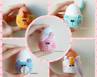 May include: Four crocheted egg cozies in different animal designs: a yellow chick, a blue cat, a pink bunny, and a white unicorn. Each cozy is handmade and features embroidered details.