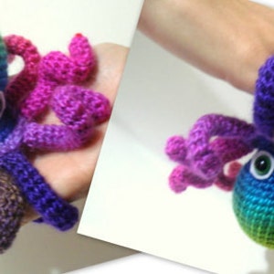 May include: A rainbow colored crocheted octopus with large googly eyes. The octopus has eight tentacles, each a different color.