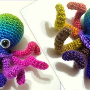 May include: A rainbow crocheted octopus with large white eyes. The octopus has eight tentacles, each a different color of the rainbow.