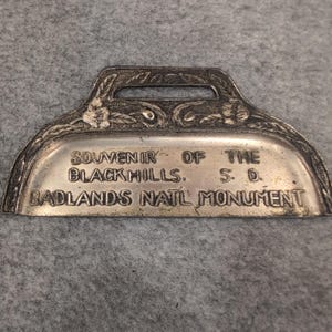 Souvenir of the Black Hills Badlands National Monument Miniature Metal Dustpan image 1