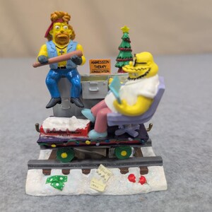 Figura navideña de Los Simpson: Terapia de vacaciones - Expreso de Navidad - Meathook Dr. Monroe 0101 imagen 1