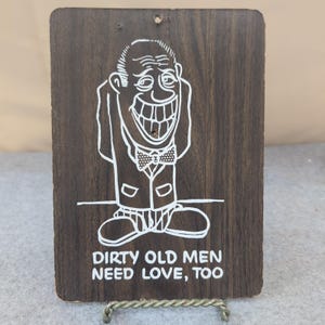 VTG 1968-73 Pressboard KMart Wall Sign Plaque "Dirty Old Men Need Love, Too" image 1