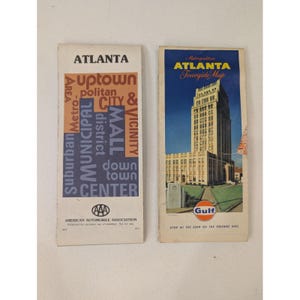 May include: Two vintage Atlanta city maps. One map features the text "Atlanta" and a list of city areas. The other map is a "Metropolitan Atlanta Tourguide Map" with a building illustration and the Gulf logo.