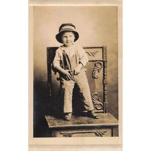 Antique RPPC Real Photo Postcard Young Boy Overalls Hat Studio VG image 1