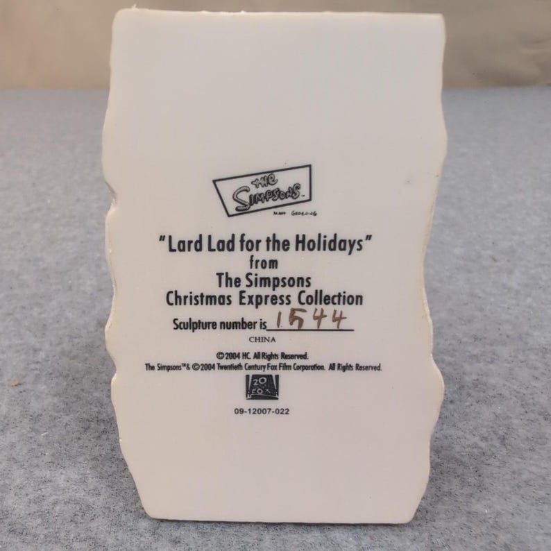 La scultura "Lard Lad for the Holidays" dei Simpson tratta da Christmas Express, numero 1544, 2004. immagine 5