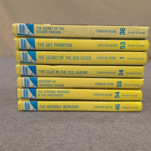 ナンシー・ドリュー探偵物語 7冊セット グロセット＆ダンラップ社刊 黄色の背表紙のハードカバー本 画像 1