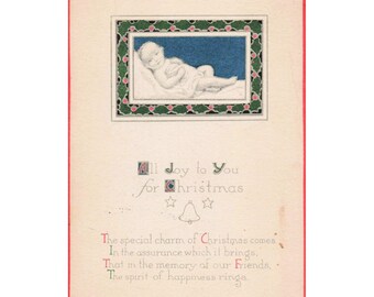 Cartão postal de Natal vintage de 1920 com bebê dormindo em Attica, Ohio. Selo de 1 centavo. Em bom estado de conservação.