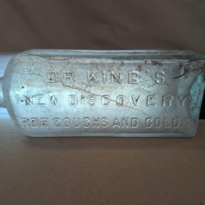 El nuevo descubrimiento del Dr. King para la tos y el resfriado Botella de vidrio antigua HE Bucklen & Co imagen 1