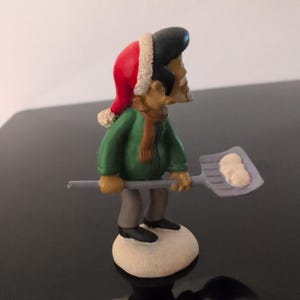 The Simpsons Apu Christmas Figurine Santa Hat Snow Shovel Winter Collectible image 2