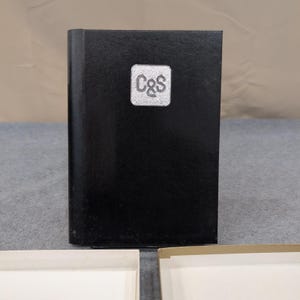 Directorio de direcciones y teléfonos C&S de 1987, tapa dura negra, organizador de espiral. imagen 1