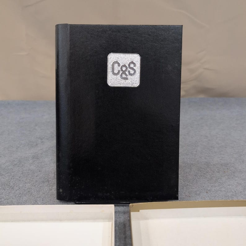 Directorio de direcciones y teléfonos C&S de 1987, tapa dura negra, organizador de espiral. imagen 1