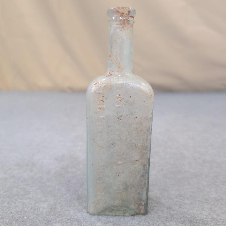 El nuevo descubrimiento del Dr. King para la tos y el resfriado Botella de vidrio antigua HE Bucklen & Co imagen 2