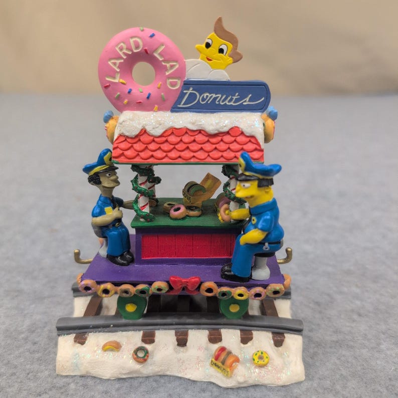 La scultura "Lard Lad for the Holidays" dei Simpson tratta da Christmas Express, numero 1544, 2004. immagine 1