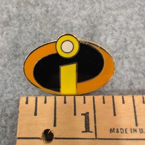 Disney Pixar The Incredibles Logo Enamel Pin Gold Tone Superhero Accessory image 2