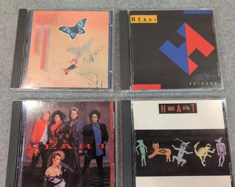 Lote de 4 CDs de Heart: Dog & Butterfly Brigade (álbumes homónimos) y Bad Animals Rock.