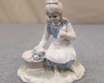 Vintage Porcelain Girl Nurse Figurine with Puppy in Basket Blue and White