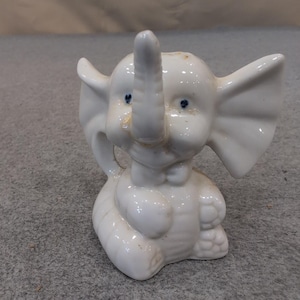 Vintage White Ceramic Elephant Figurine Seated Trunk Up Blue Eyes Bow Tie image 1