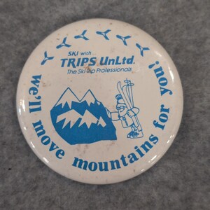 Vintage TRIPS UnLtd Ski Trip Professionals Button Pin We'll Move Mountains image 1