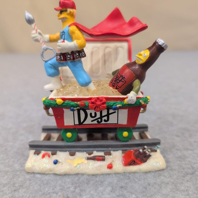 The Simpsons Christmas Express Holiday Spirits Duffman Sculpture 2005 imagen 1