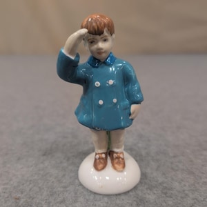 Vintage Porcelain Saluting Boy Figurine Blue Coat Hand Painted Collectible image 1