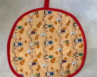 Salvamanteles reversible acolchado Peanuts y cubremesa (grande)